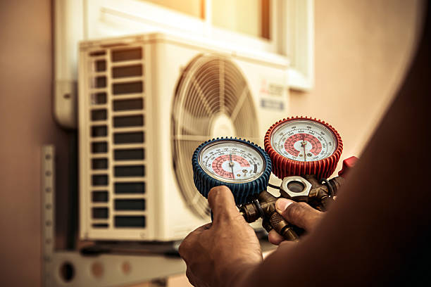 Professional Air Conditioning Service technician working in Mascotte, FL